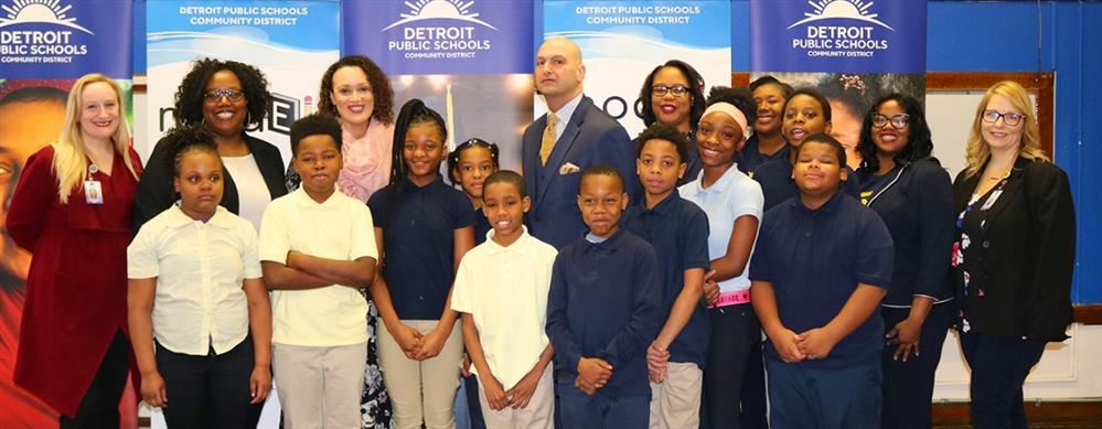 Dr Vitti with students at press conference 